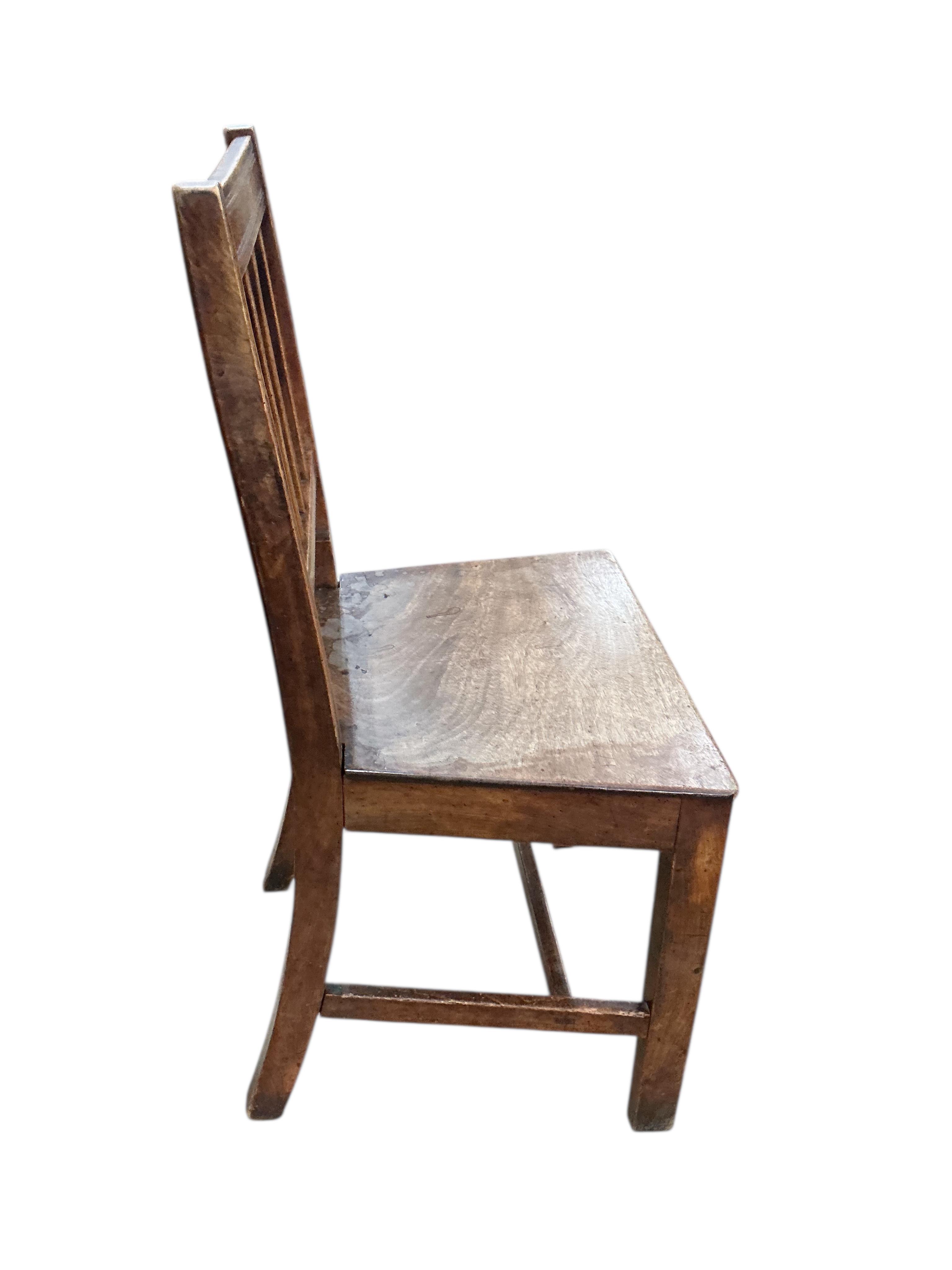 A set of six George III Provincial fruitwood and mahogany dining chairs